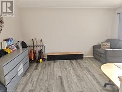 Sitting room featuring light wood-type flooring - 