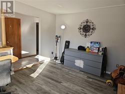 Bedroom featuring hardwood / wood-style flooring - 