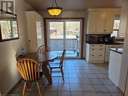 Dining room featuring light tile patterned floors - 