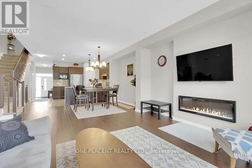 405 Cope Drive W, Ottawa, ON - Indoor Photo Showing Living Room With Fireplace