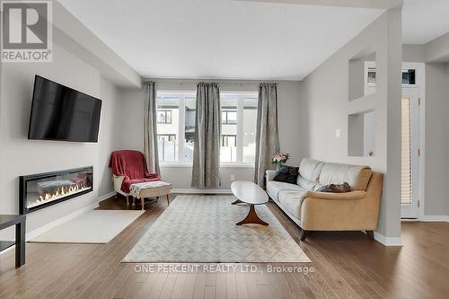 405 Cope Drive W, Ottawa, ON - Indoor Photo Showing Living Room With Fireplace