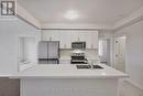 12 Oakmont Drive, Loyalist, ON  - Indoor Photo Showing Kitchen With Double Sink 