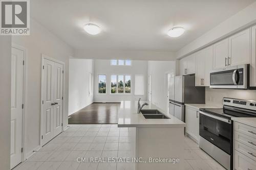 12 Oakmont Drive, Loyalist, ON - Indoor Photo Showing Kitchen With Double Sink