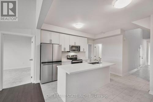 12 Oakmont Drive, Loyalist, ON - Indoor Photo Showing Kitchen With Double Sink