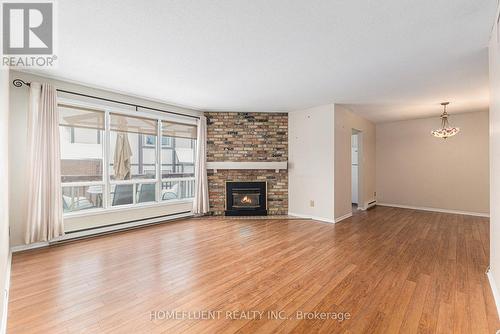 C - 7 Harness Lane, Ottawa, ON - Indoor Photo Showing Living Room With Fireplace