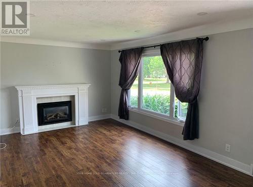 Main - 24 Manor Road, St. Catharines, ON - Indoor Photo Showing Living Room With Fireplace