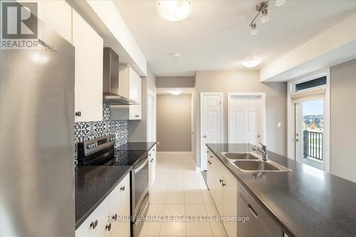 48 Oat Lane, Kitchener, ON - Indoor Photo Showing Kitchen With Double Sink