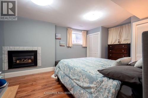 795744 Grey Road 19, Blue Mountains, ON - Indoor Photo Showing Bedroom With Fireplace