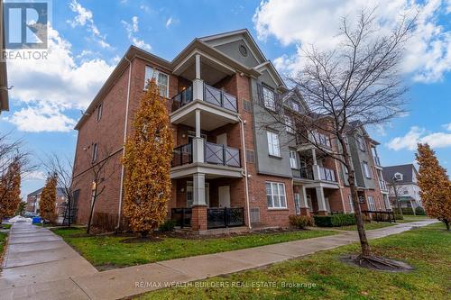 202 - 2333 Sawgrass Drive, Oakville, ON - Outdoor With Balcony With Facade