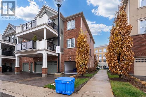 202 - 2333 Sawgrass Drive, Oakville, ON - Outdoor With Balcony With Facade