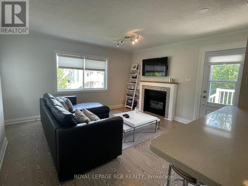 59 - 19 Dawson Drive, Collingwood, ON - Indoor Photo Showing Living Room With Fireplace