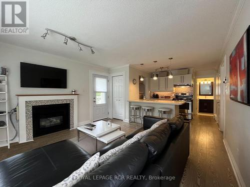 59 - 19 Dawson Drive, Collingwood, ON - Indoor Photo Showing Living Room With Fireplace