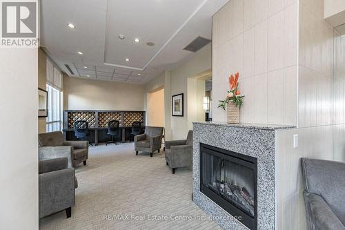 1510 - 3504 Hurontario Street, Mississauga (Hurontario), ON - Indoor Photo Showing Living Room With Fireplace