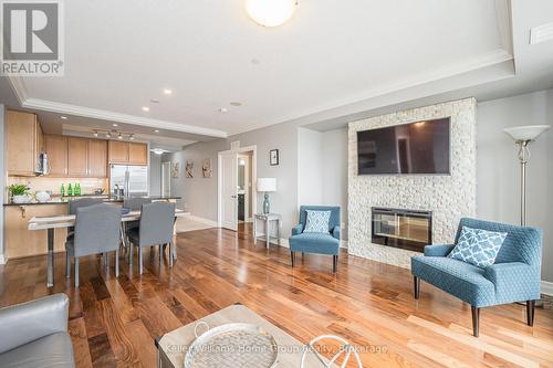 901 - 150 Wellington Street E, Guelph (Central West), ON - Indoor Photo Showing Living Room With Fireplace