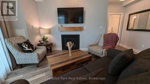 316 - 25 Pen Lake Point Road, Huntsville (Chaffey), ON - Indoor Photo Showing Living Room With Fireplace