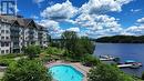 316 - 25 Pen Lake Point Road, Huntsville (Chaffey), ON  - Outdoor With Body Of Water With In Ground Pool With View 