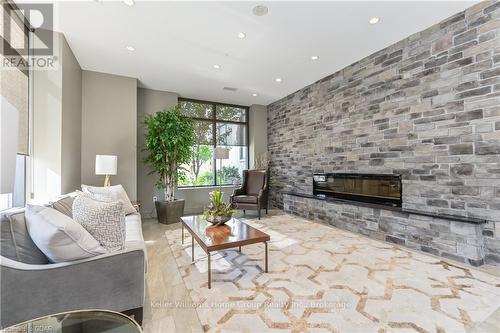 708 - 160 Macdonell Street, Guelph (Central West), ON - Indoor Photo Showing Living Room With Fireplace