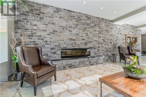 708 - 160 Macdonell Street, Guelph (Central West), ON - Indoor Photo Showing Living Room With Fireplace