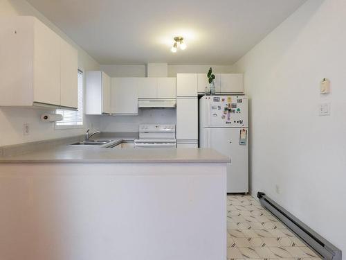 Kitchen - 91 Rue De Neuville, L'Île-Perrot, QC - Indoor Photo Showing Kitchen With Double Sink