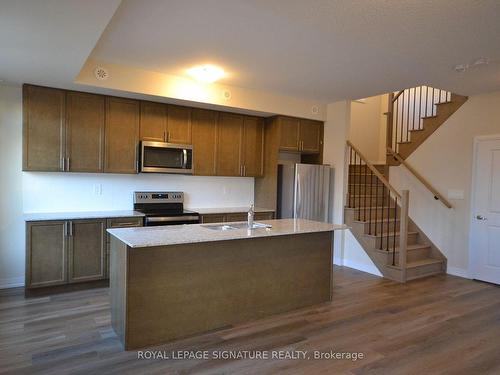 116-1597 Rose Way, Milton, ON - Indoor Photo Showing Kitchen With Double Sink