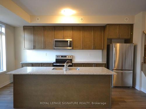 116-1597 Rose Way, Milton, ON - Indoor Photo Showing Kitchen With Double Sink