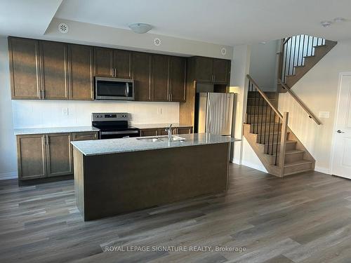 116-1597 Rose Way, Milton, ON - Indoor Photo Showing Kitchen With Double Sink