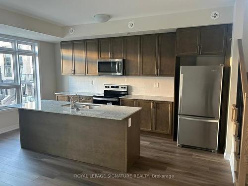 116-1597 Rose Way, Milton, ON - Indoor Photo Showing Kitchen With Stainless Steel Kitchen With Double Sink