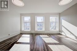 Featuring laminate wood-style floors and crown molding - 