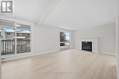 59B - 794 St. Andre Drive, Ottawa, ON - Indoor Photo Showing Living Room With Fireplace