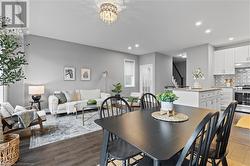 Dining space featuring dark hardwood / wood-style flooring and a chandelier - 