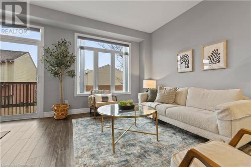 Living room with wood-type flooring - 1023 Devonshire Avenue Unit# 5, Woodstock, ON - Indoor Photo Showing Living Room