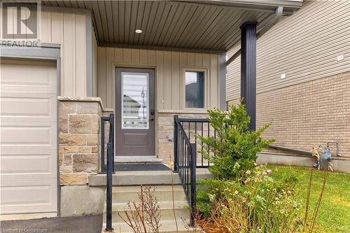 Doorway to property with a garage - 1023 Devonshire Avenue Unit# 5, Woodstock, ON - Outdoor With Exterior