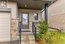 Doorway to property with a garage - 1023 Devonshire Avenue Unit# 5, Woodstock, ON  - Outdoor With Exterior 