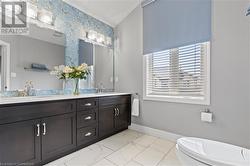 Bathroom with vanity and toilet - 