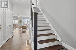 Stairs featuring wood-type flooring - 