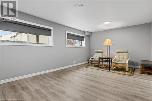 Sitting room featuring plenty of natural light and light wood-type flooring - 1023 Devonshire Avenue Unit# 5, Woodstock, ON - Indoor