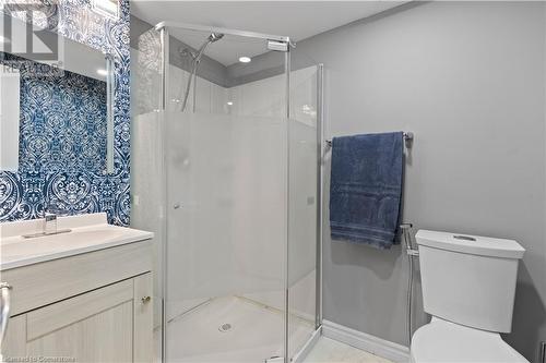 Bathroom featuring vanity, toilet, and a shower with door - 1023 Devonshire Avenue Unit# 5, Woodstock, ON - Indoor Photo Showing Bathroom