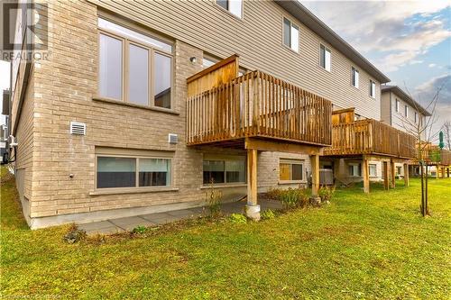 Back of property featuring a yard, central air condition unit, and a wooden deck - 1023 Devonshire Avenue Unit# 5, Woodstock, ON - Outdoor With Deck Patio Veranda With Exterior