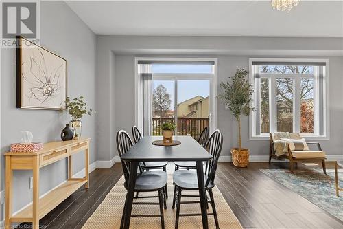 Dining space with dark hardwood / wood-style floors - 1023 Devonshire Avenue Unit# 5, Woodstock, ON - Indoor Photo Showing Dining Room