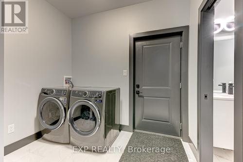 Garage Entrance to mudroom/laundry with sink - 86 Optimist Drive, Southwold (Talbotville), ON - Indoor Photo Showing Laundry Room