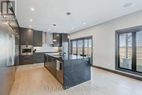 Cambria quartz countertops with waterfall $$$ - 86 Optimist Drive, Southwold (Talbotville), ON - Indoor Photo Showing Kitchen With Upgraded Kitchen