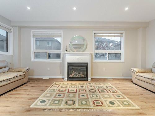 22-7155 Magistrate Terr, Mississauga, ON - Indoor Photo Showing Living Room With Fireplace