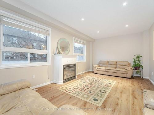 22-7155 Magistrate Terr, Mississauga, ON - Indoor Photo Showing Living Room With Fireplace