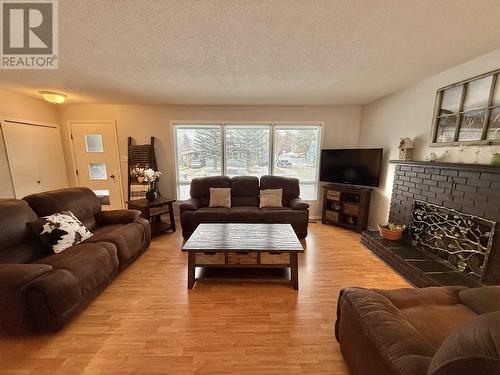 239 Lazzarin Street, Quesnel, BC - Indoor Photo Showing Living Room With Fireplace