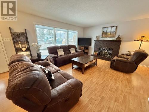 239 Lazzarin Street, Quesnel, BC - Indoor Photo Showing Living Room With Fireplace