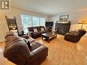 239 Lazzarin Street, Quesnel, BC  - Indoor Photo Showing Living Room With Fireplace 