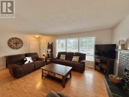 239 Lazzarin Street, Quesnel, BC - Indoor Photo Showing Living Room With Fireplace