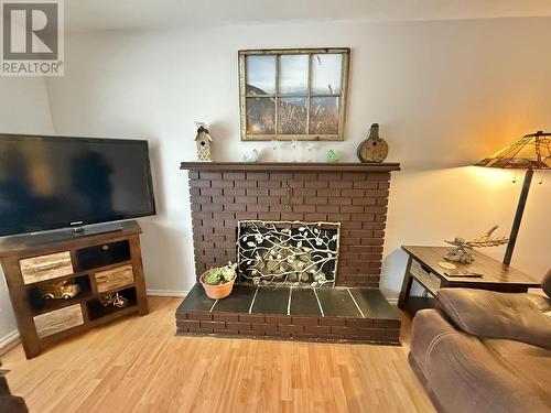 239 Lazzarin Street, Quesnel, BC - Indoor Photo Showing Living Room With Fireplace