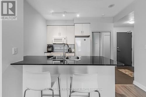 1210 - 4070 Confederation Parkway, Mississauga, ON - Indoor Photo Showing Kitchen With Double Sink