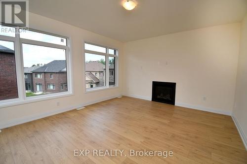 56 Bearberry Road, Springwater, ON - Indoor Photo Showing Other Room With Fireplace